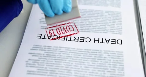 Pathologist putting red covid19 stamp on death certificate closeup 4k movie Stock Footage 170296004