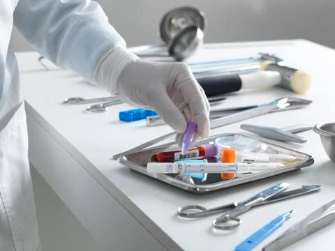 Pathologist taking a sample for analysis during a autopsy Stock Photos