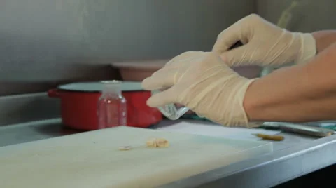 Pathologist using tweezer for analyzing tissue sample in the lab, hands close up Stock Footage 53086814