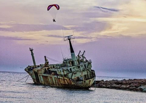 Pathos, Cyprus - May 21, 2016 - Person uses powered paraglide to circle a Foto stock