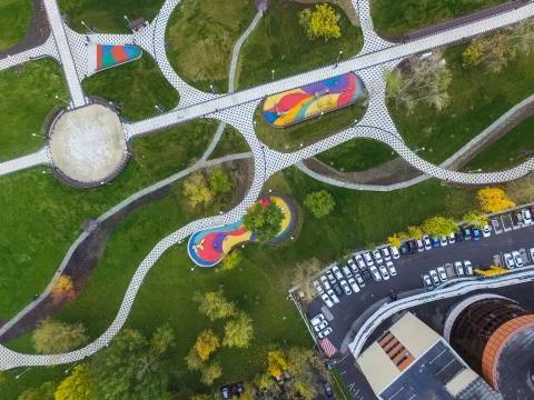 Paths in the park of paving slabs, top view of the city park. Stock Photos