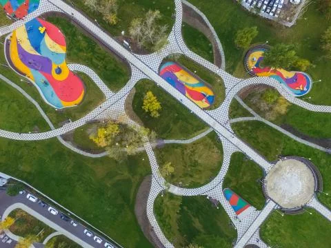 Paths in the park of paving slabs, top view of the city park. Stock Photos