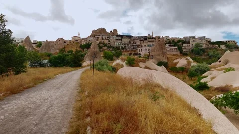 Pathway Approaching Uchisar Town with Unique Rock Formations in Cappadocia Stockbeeldmateriaal 347983660