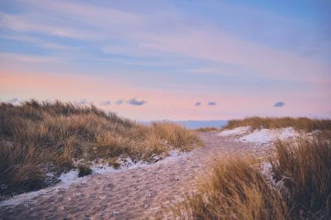Pathway to the beach during evening in winter Stock Photos