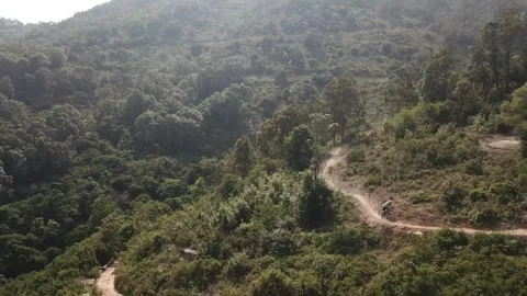 Pathway with bikers on a hill Stock Footage 299949459