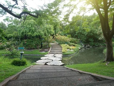 Pathway with bridge in the park Stock Photos