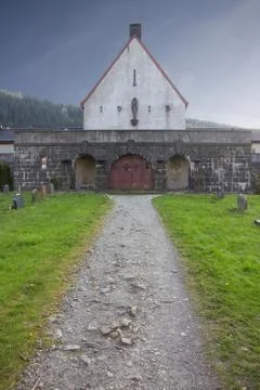 Pathway to buildning in graveyard Stock Photos
