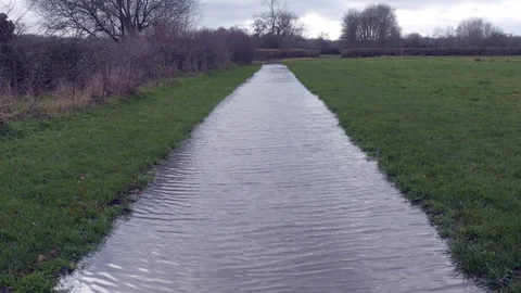 A pathway flooded after heavy rainfall Stock Footage 122201159