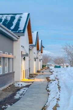 Pathway in front of homes viewed in winter Stock Photos