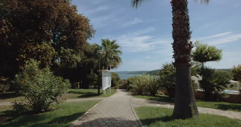 Pathway leading towards the ocean at a vacation resort Stock Footage 254944032