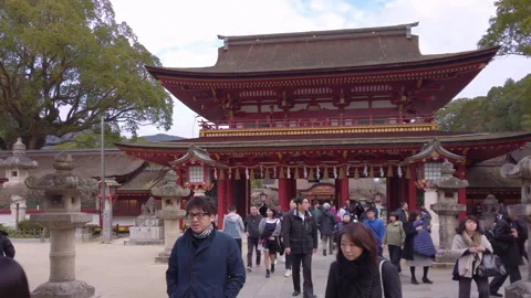 Pathway leading to the two-storied Rōmon gate of the Japanese Dazaifu shrine. Stock Footage 247665354