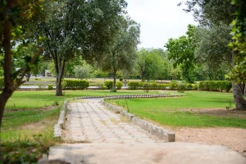 A pathway leads through the park from a rest area on the motorway from Laho.. Stock Photos