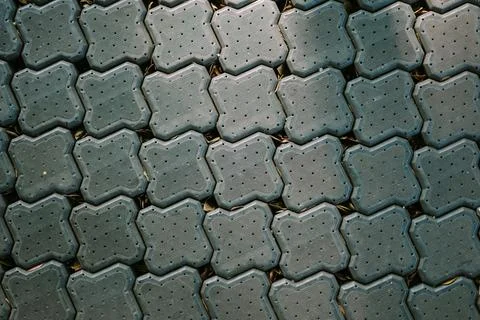 A pathway made of paving blocks crafted from recycled plastic waste, showca.. Stock-Fotos