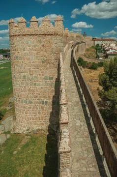 Pathway over old thick wall encircling the town of Avila Stock Photos