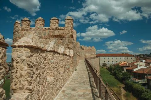 Pathway over old thick wall encircling the town of Avila Stock Photos