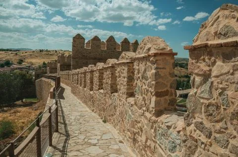 Pathway over old thick wall encircling the town of Avila Stock Photos
