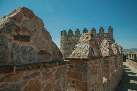 Pathway over thick stone wall with merlons at Avila Stock Photos