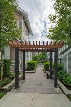 Pathway in residential area between two rows of townhouses. Stock Photos