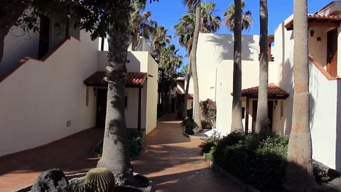 Pathway through bungalows of beach resort Stock Footage 84788650