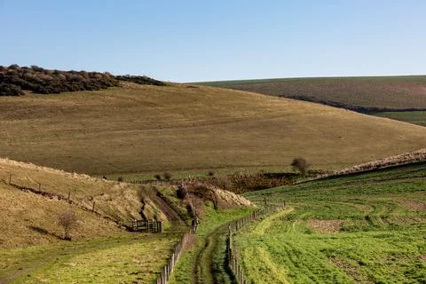 A pathway through a rural South Downs landscape on a sunny winters day Stock Photos