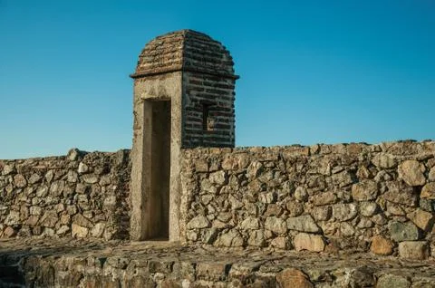 Pathway on top of thick stone wall with a small watchtower Stock Photos