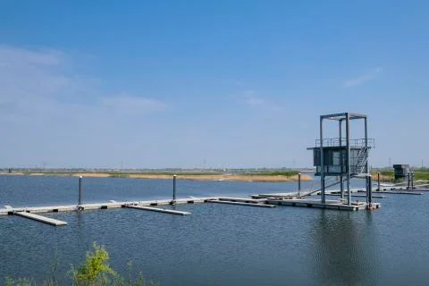 A pathway towards the water for rowing courses under a blue sky Stock Photos