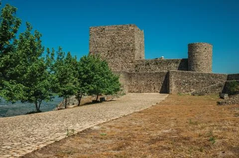 Pathway with trees going to wall and tower at the Marvao Castle Stock Photos