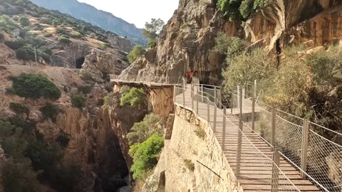 Pathway with two Staff members, mountains, Caminito del Rey Video stock 220741573