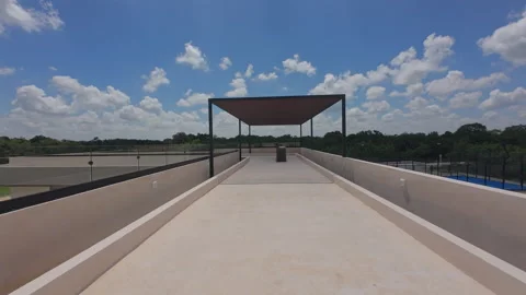 Pathway under slatted roof with rooftop view Stock Footage 318598959