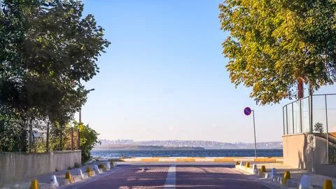 Pathway with a warning sign under the sun, symbolizing challenges and direc.. Stock Photos