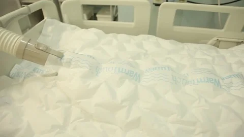 The patient after the operation lies using a blanket for heating Stock Footage 82000323