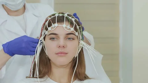 Patient brain testing using encephalography at medical center Stock Footage 158640133