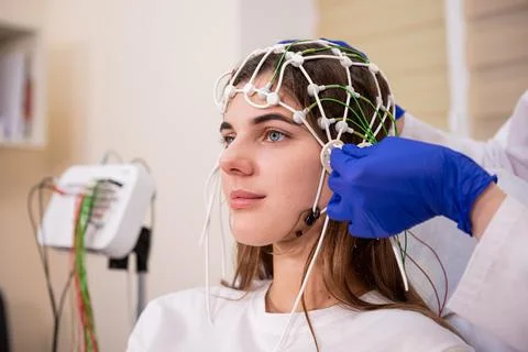 Patient brain testing using encephalography at medical center Stock Photos