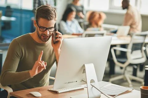 Patient call-center operator gesturing during a phone-call Stock Photos