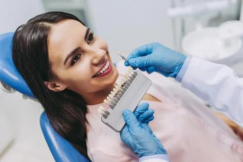 Patient choosing tooth implants Stock Photos