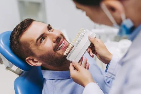 Patient choosing tooth implants Stock Photos
