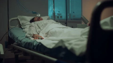 Patient connected artificial breathing tubes in hospital intensive care unit. Stock Footage 180945879