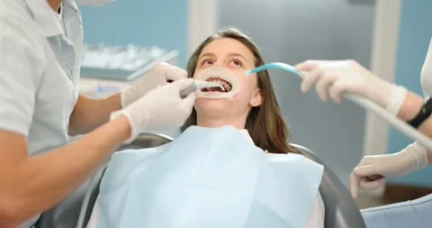 Patient with dental braces during a regular orthodontic visit Stock Footage 147889703