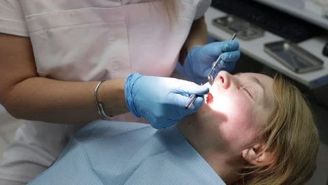 Patient at the dentist22 Stock Footage 123926836