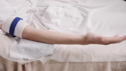 Patient does hand exercise for taking blood sample for test Stock Footage 201145685