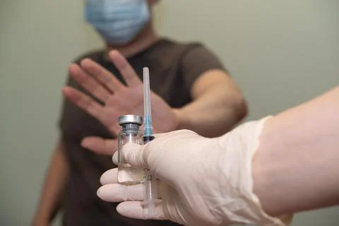 The patient does not agree to put the vaccine, vaccination. Stock Photos