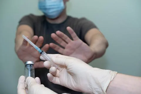 The patient does not agree to put the vaccine, vaccination. Stock Photos