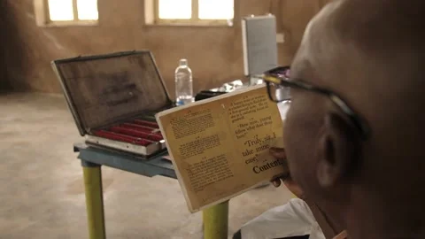 Patient doing Eye test with eye chart in  rural clinic 動画素材 165455469