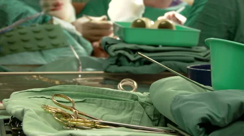 Patient during surgery. Sterile instruments. Surgeons team in operation room Stock Footage 61069831