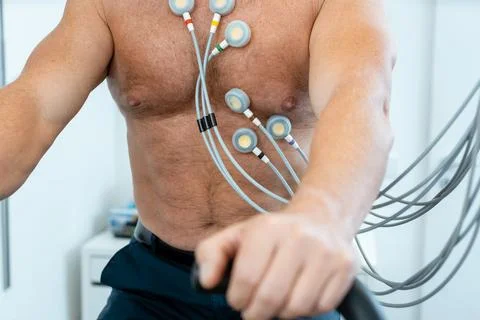 Patient on exercise bike with electrodes during ECG Stock Photos