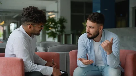 Patient explaining problem to therapist during therapy session Stock Footage 316723970