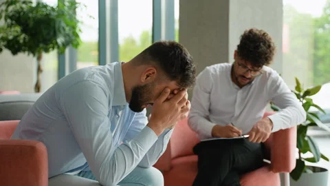 Patient explaining problems to psychologist during therapy session Stock Footage 316725836