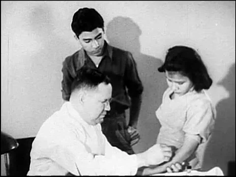 A patient is given a tuberculin test and her sister arrives at a sanitarium for Stock Footage 75007725