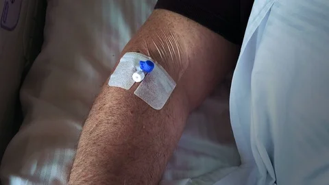 Patient hand with dropper Stock Footage 109491240