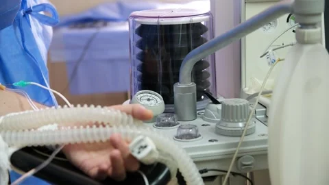 Patient hand holding ventilator tubes in hospital room Stock Footage 316398457